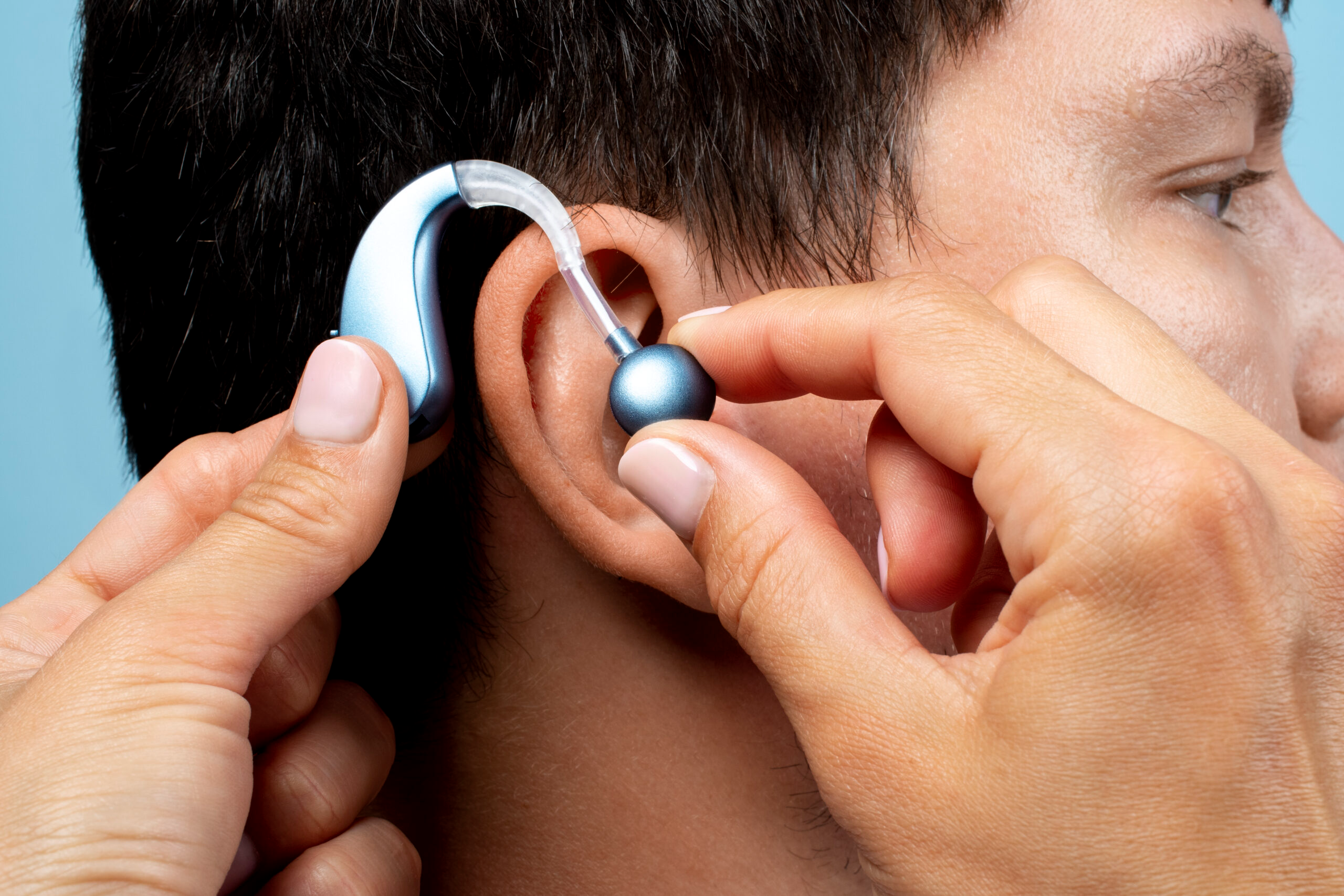 man-wearing-hearing-aids-side-vi (1) (2)